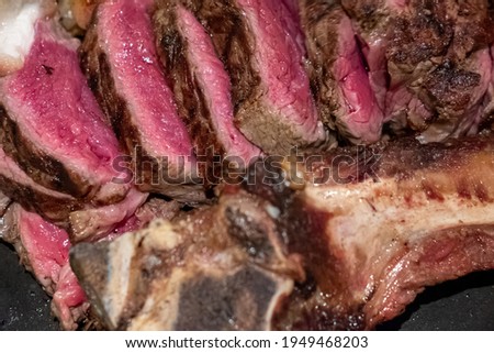 Medium rare Tomahawk meat on plate