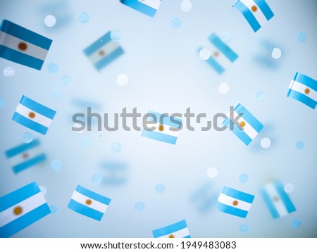 Argentina Independence Day. July 9. National flags on a foggy background. The concept of memory, patriotism and freedom. High quality photo