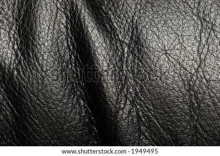 Black leather surface with wrinkles