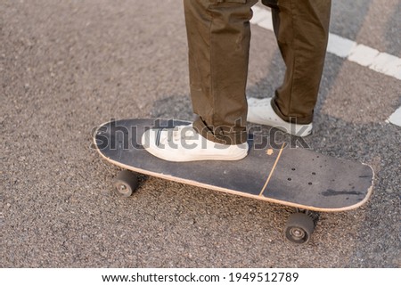 Skateboard in car park on concrete