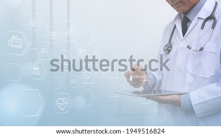 Medicine doctor hand touching on digital tablet computer as interface medical network connection with health icons on virtual screen, medical technology network, smart health, telemedicine concept Royalty-Free Stock Photo #1949516824