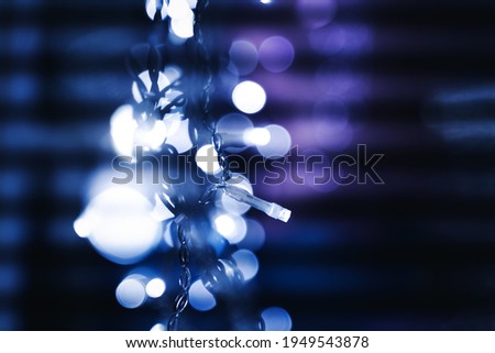 Glowing blue electric garlands, beautiful bright abstract celebration background texture