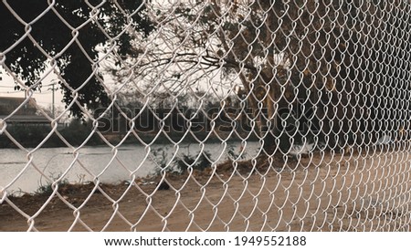 Mesh fence. White metal fence made of welded mesh
