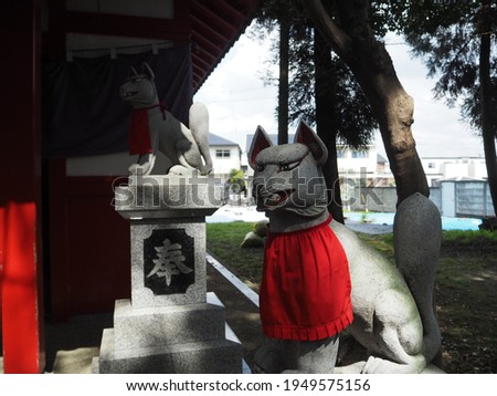 Inari protecting the shrine.Translation on statue text "dedication".