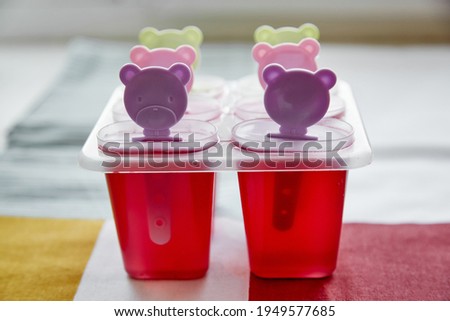 Multi-colored jelly in children's moulds with a teddy bear