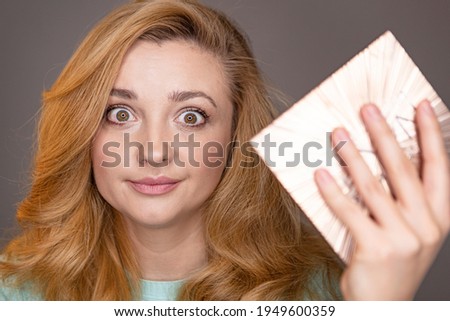 make-up blogger testing decorative cosmetics in front of the camera