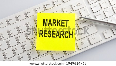 text MARKET RESEARCH on keyboard on white background