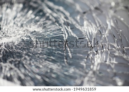 Crack on the glass. Broken screen. Broken phone. Cracked glass background. White cracks in glass.
