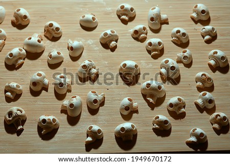 lot of skulls background, abstract texture mushrooms champignena natural decoration for the holiday food halloween day of the dead