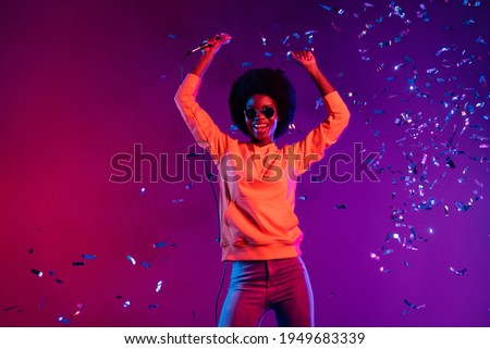 Photo of pretty shiny dark skin woman wear sweatshirt singing microphone dancing isolated gradient background