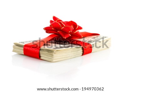 Money gift (big stack of dollars with red bow isolated on white background