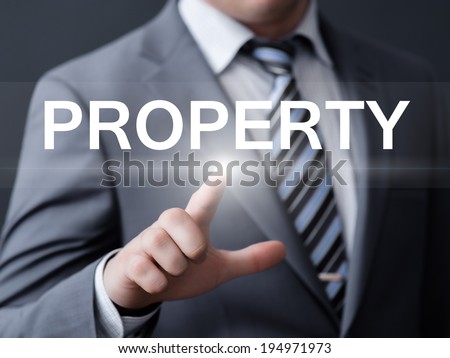 business, technology, internet and networking concept - businessman pressing property button on virtual screens