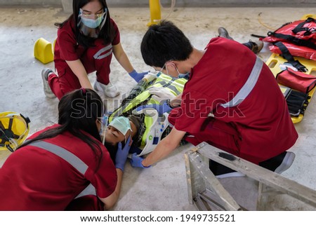 First aid for head injuries and Considered for all trauma incidents of worker in work, Loss of feeling or loss of normal movement and Loss of function in limbs, First aid training to transfer patient. Royalty-Free Stock Photo #1949735521