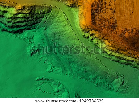 Model of a mine elevation. GIS product made after processing aerial pictures taken from a drone. It shows excavation site with steep rock walls Royalty-Free Stock Photo #1949736529