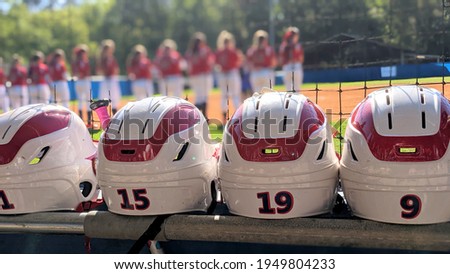 Fast Pitch Softball helmets with the girls on the field.