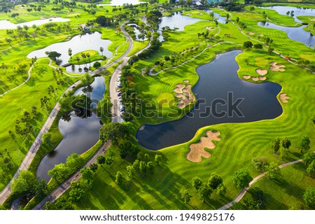 Golf course beautiful Aerial view of golf field landscape with sunrise view in the morning shot. Bangkok Thailand Royalty-Free Stock Photo #1949825176