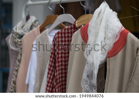 The outer women's clothing on the hanger in the store