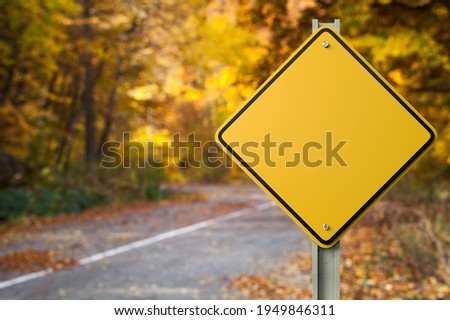 Yellow blank Sign on Autumn Background