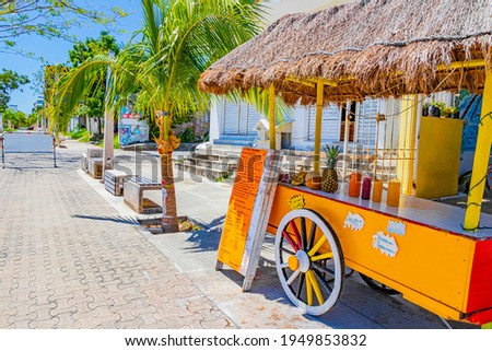 Drivable orange tropical juice shop on wheels in Playa del Carmen Mexico Royalty-Free Stock Photo #1949853832