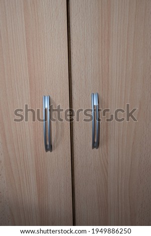 two very light wooden doors