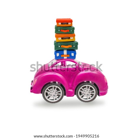 A car with a stack of suitcases, luggage on the roof