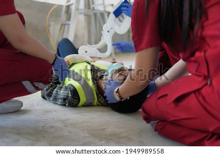 First aid for head injuries and Considered for all trauma incidents of worker in work, Loss of feeling or loss of normal movement and Loss of function in limbs, First aid training to transfer patient. Royalty-Free Stock Photo #1949989558