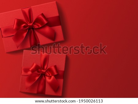 Two red gift boxes on red background , valentine's presents top view flat lay Royalty-Free Stock Photo #1950026113