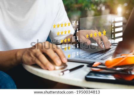 User give rating to service experience on online application, Customer review satisfaction feedback survey concept, Customer can evaluate quality of service leading to reputation ranking of business. Royalty-Free Stock Photo #1950034813