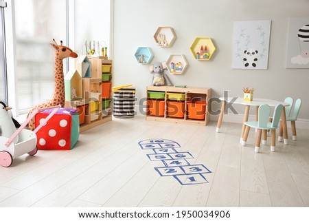 Blue hopscotch floor sticker in playing room Royalty-Free Stock Photo #1950034906