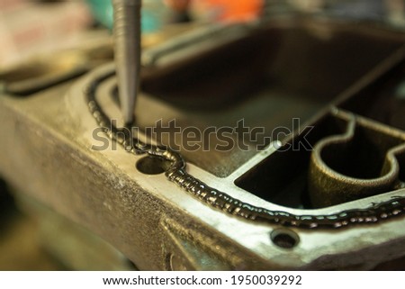 Detail of Sealant on the mechanical part Royalty-Free Stock Photo #1950039292