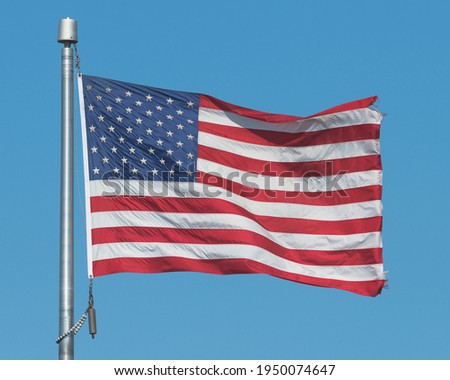 United States American flag waving in a strong wind