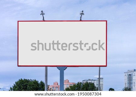 Street big white billboard in red metal frame with empty space for mockup