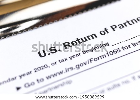 US tax form 1065 Return of Partnership Income close up Royalty-Free Stock Photo #1950089599