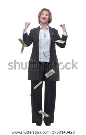 Portrait of excited mature woman under a money rain