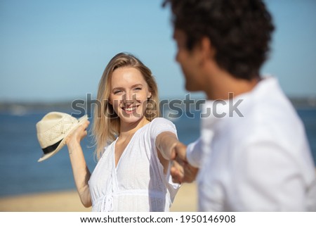 happy young couple having fun at beach