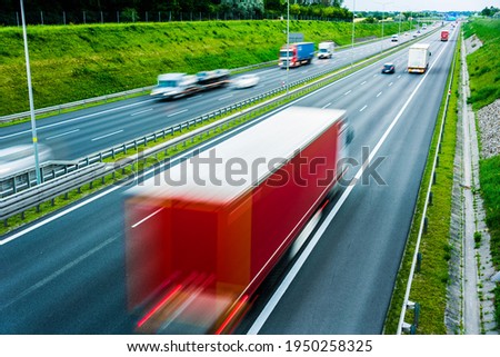 Trucks on six lane controlled-access highway in Poland.
 Royalty-Free Stock Photo #1950258325
