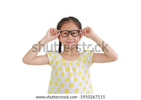 Portrait of smiling asian little girl child wearing glasses isolated on white background