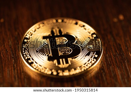 Crypto Coin, physical Bitcoin coin in gold. Digital currency concept representation of Cryptocurrency