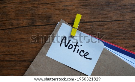 Notice message concept written post it on envelope. Royalty-Free Stock Photo #1950321829