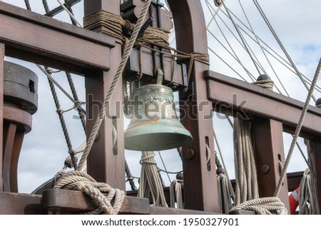 a bell on the stern of an old sailing ship