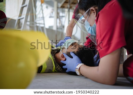 First aid for head injuries and Considered for all trauma incidents of worker in work, Loss of feeling or loss of normal movement and Loss of function in limbs, First aid training to transfer patient. Royalty-Free Stock Photo #1950340222