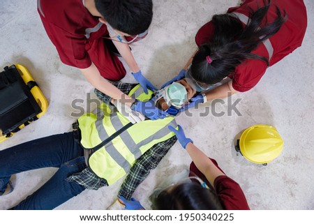 First aid for head injuries and Considered for all trauma incidents of worker in work, Loss of feeling or loss of normal movement and Loss of function in limbs, First aid training to transfer patient. Royalty-Free Stock Photo #1950340225