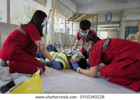 First aid for head injuries and Considered for all trauma incidents of worker in work, Loss of feeling or loss of normal movement and Loss of function in limbs, First aid training to transfer patient. Royalty-Free Stock Photo #1950340228