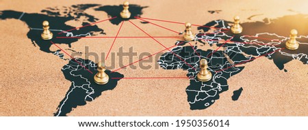 concept of geopolitics or worldwide economy. chess figures placed on map banner Royalty-Free Stock Photo #1950356014
