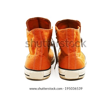 Vintage orange shoes from the back. Isolated on white background 