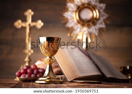 Holy communion. Catholic theme. Wooden background. Place for typography. Royalty-Free Stock Photo #1950369751