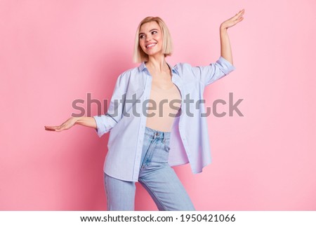 Photo of attractive young happy nice lady raise hands good mood dance isolated on pastel pink color background