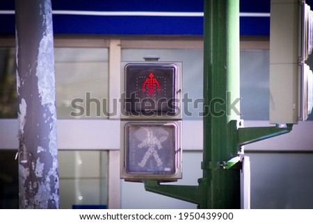 Traffic light on the street with red signaling for pedestrians. No people