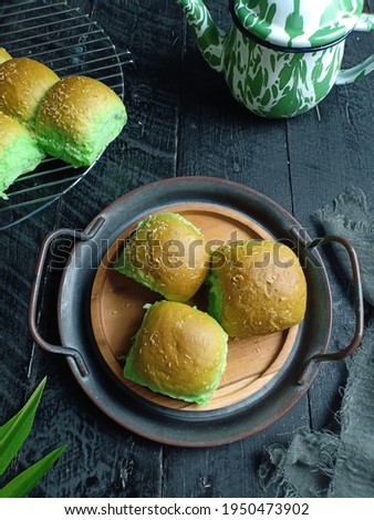 Roti Sobek Pandan or Pandan Pull Out Bread on wooden plate. Isolated, Copy Space for Text Royalty-Free Stock Photo #1950473902