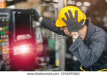 engineer worker inexperienced service man confuse nervous and stressful to fix and operate broken machine problem in factory Royalty-Free Stock Photo #1950495865